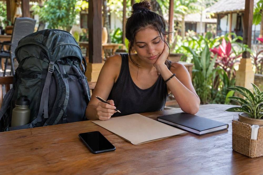 Travel documents and an online arrival form ready before a backpacking trip